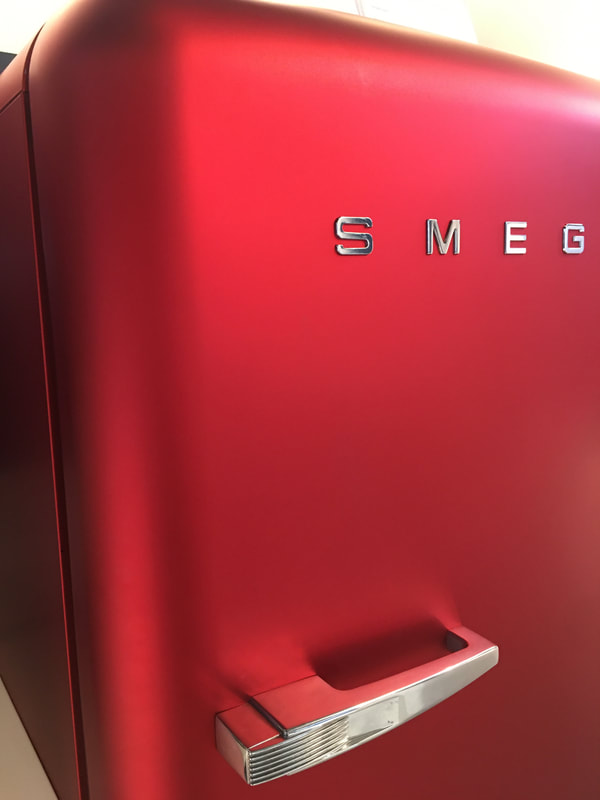 Metallic, red, retro fridge from Smeg