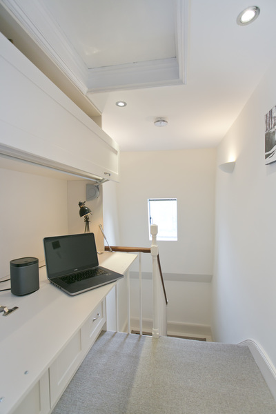 Clever storage, compact, white, home office on landing in Islington, London, UK