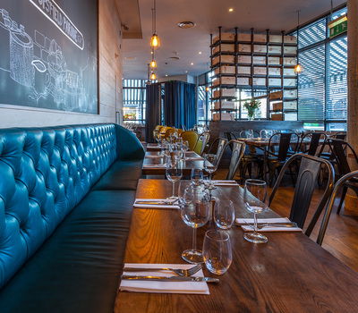 Teal coloured, bespoke banquette seating in North London Restaurant, Melange